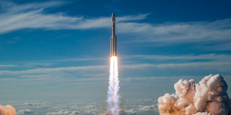 Rocket in the blue sky with white clouds. 3d rendering.の素材