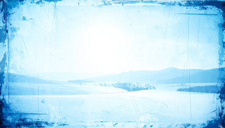 grunge winter landscape with snow covered fields and blue sky backgroundの素材