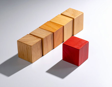 Wooden blocks on a white background. The concept of leadership and successの素材