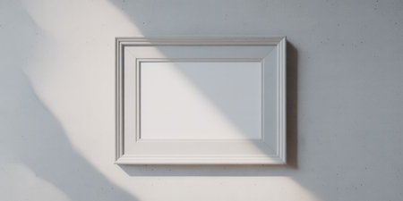 White picture frame on the white wall. 3D Rendering.の素材