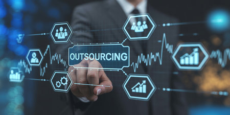 Businessman touching a Outsourcing concept on a touch screen with his fingerの素材