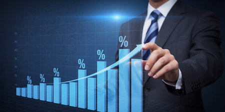 Businessman plan graph growth and increase of chart positive indicators in his businessの素材