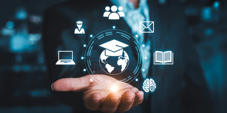 E-learning, Online education, E-learning concept. Businessman hand holding virtual screen with online education iconsの素材