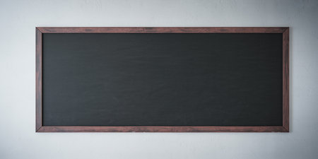 Blank chalkboard on the white wall, vintage color tone.の素材