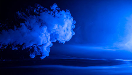 Cloud of blue ink in water. Ink swirling in water. Abstract backgroundの素材