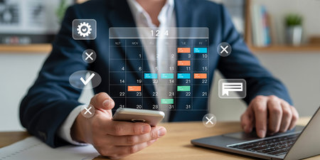 Businessman using smart phone and laptop computer with social media icons.の素材