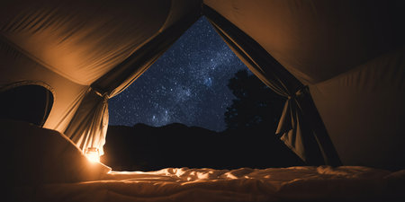 Silhouette of tourist tent and starry sky at night.の素材