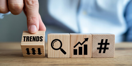 Businessman hand placing a block with the word Trends. Conceptual image.の素材
