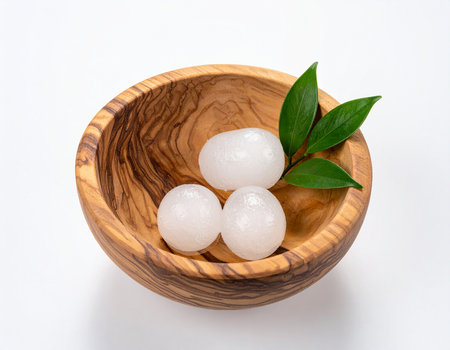 Mochi japanese dessert in wooden bowl on white backgroundの素材