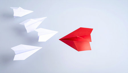 Leadership concept with paper plane and white paper planes on white backgroundの素材