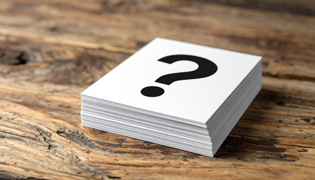 Question mark on paper cards on wooden background. Question mark concept.の素材