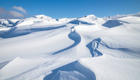 Snowy mountains under blue sky in winter, Caucasus Mountains, Georgiaの素材