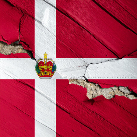 Close up grunge flag of Denmark on cracked wall background. National flag of Denmarkの素材