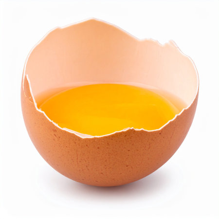 Broken egg isolated on white background. Clipping path included.の素材
