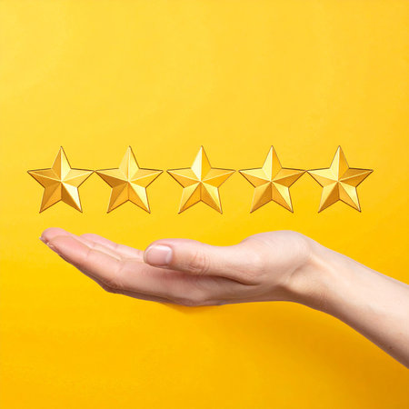 Customer review concept. Female hand holding five golden stars on yellow backgroundの素材