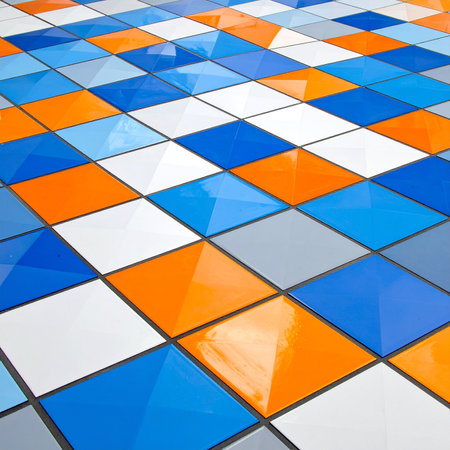 abstract background of colored ceramic tiles in the wall of a buildingの素材