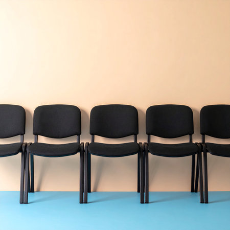 Row of black chairs on blue and beige background. 3d renderの素材