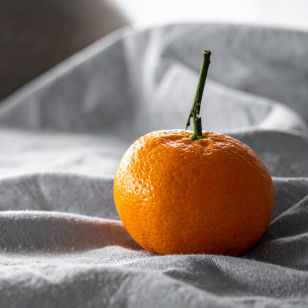 Ripe tangerine on a white background. Close-up.の素材