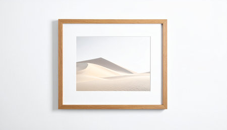 Wooden picture frame on white wall with sand dunes in desertの素材