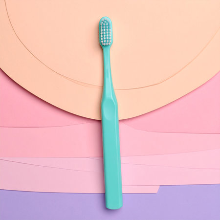 Toothbrush on colorful paper background. Flat lay, top viewの素材