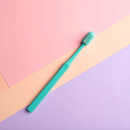 Green toothbrush on colorful background, flat lay. Space for textの素材
