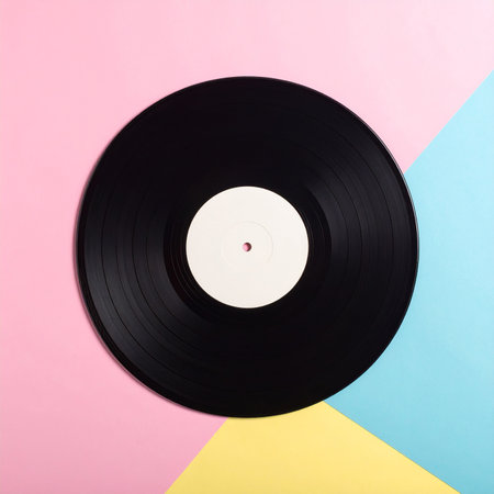 Black vinyl record on colorful background. Minimal style. Top view.の素材