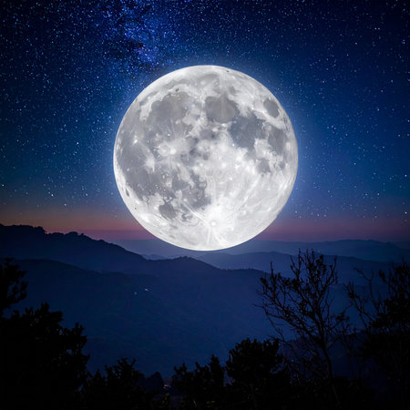 Full moon in the night sky over the mountains. Natural landscape.の素材