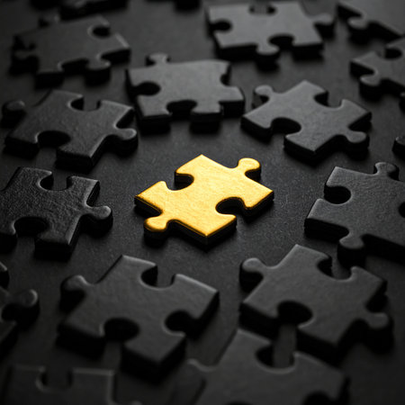Golden puzzle piece on black background. Business concept. Selective focus.の素材