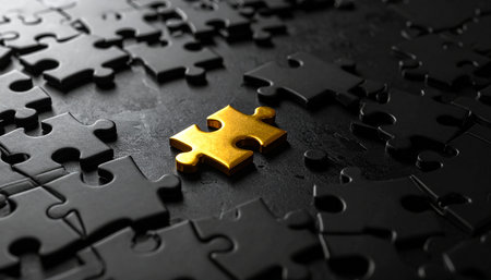 Golden jigsaw puzzle piece on black background. 3D illustration.の素材
