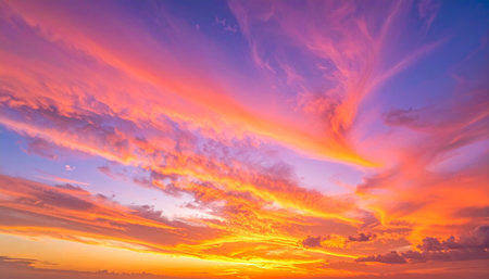 Beautiful sunset sky background. Colorful cloudscape at sunset.の素材