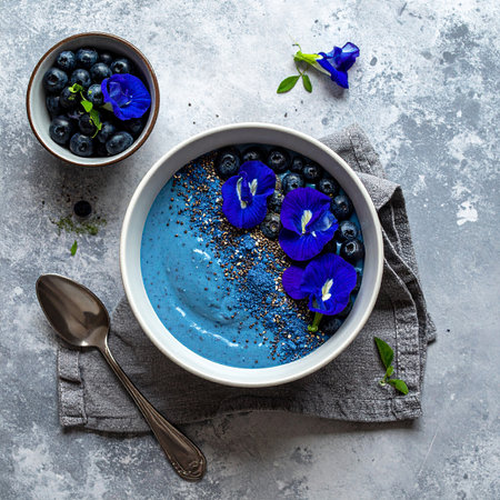 Blueberry smoothie bowl with chia seeds, blueberries and mint. Healthy breakfast concept.の素材