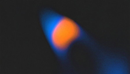 Blue and orange light on black background. Abstract blue and orange background.の素材