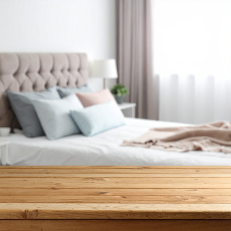 Wood table top on blur bedroom background - can be used for display or montage your productsの素材