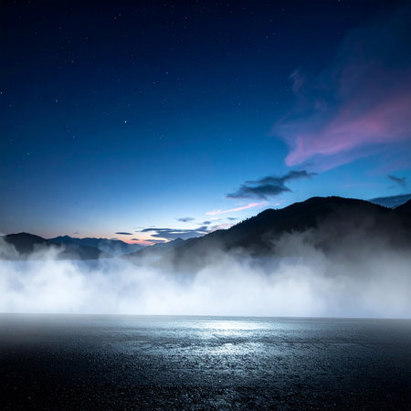 Night landscape with road in the mountains and blue sky with clouds.の素材