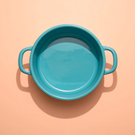 Blue ceramic soup bowl on pastel background. Minimal style.の素材