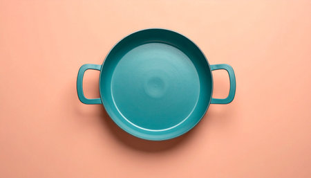 Blue ceramic cooking pot on pink background. Top view. Flat lay.の素材