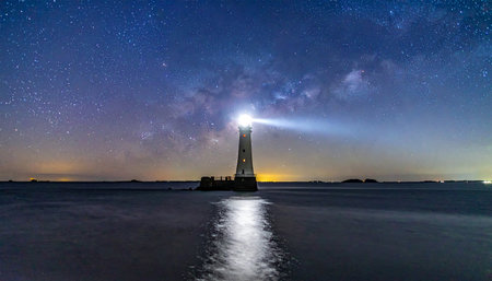 Lighthouse and milky way at night with starry sky.の素材