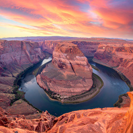 Horseshoe Bend Arizona at sunset with a colorful sky over the Colorado River canyon.の素材