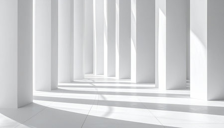 Bright white interior hallway with tall rectangular pillars and dynamic light and shadow patterns.の素材