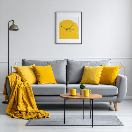 A gray sofa with yellow accents and a coffee table in a modern living room. Clear details and vibrant colors ...の素材