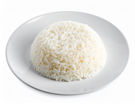 A dome of perfectly cooked white rice presented on a white plate Clear details and vibrant colors enhance vis...の素材