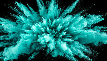 A vibrant teal powder explosion frozen in mid-air against a black background. Clear details and vibrant color...の素材