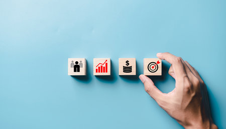 Business concept image of wooden blocks with business icons over blue background.の素材