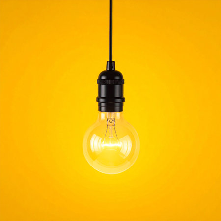 Vintage light bulb on a yellow background. 3d rendering.の素材