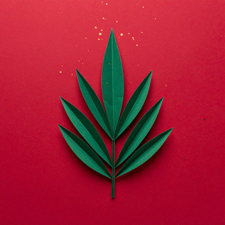 Creative layout made of green leaves on red background. Flat lay. Nature concept.の素材