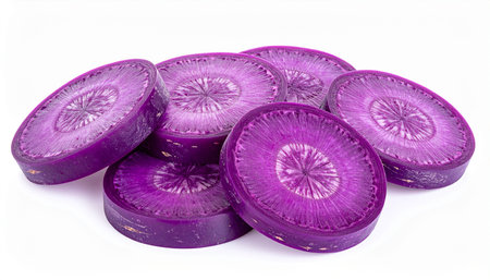 Several purple carrot slices arranged loosely, showcasing their vibrant color and detailed radial patterns on...の素材