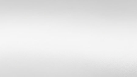 A soft white gradient background with a subtle grain texture and gentle diffused light, offering a clean and minimal aesthetic.の素材