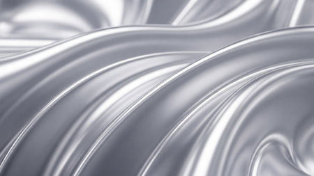 Gleaming silver liquid metal forms smooth, flowing waves with a highly reflective surface, creating a luxurious and abstract texture.の素材