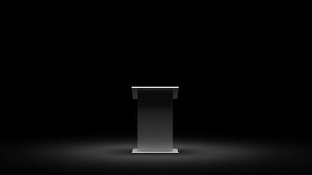 A sleek, rectangular podium with a white top surface, standing on a dark floor and illuminated by a spotlight from above.の素材