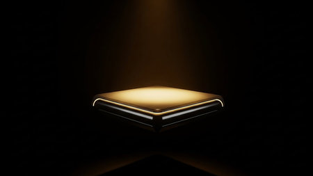 A futuristic square display platform with illuminated golden edges, highlighted by a spotlight against a dark background.の素材